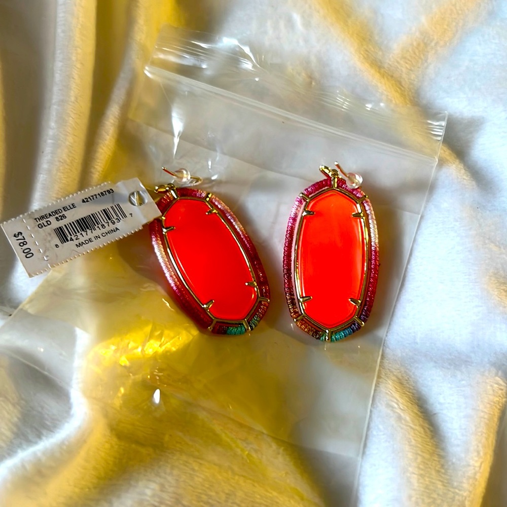 Peach Kendra Scott earrings